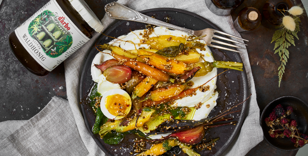 Honey-glazed rainbow carrots on labneh